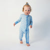 Soft bamboo baby pajamas in blue wave print, eco-friendly sleepwear.