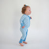 Soft bamboo baby pajamas in blue wave print, eco-friendly sleepwear.