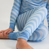 Soft bamboo baby pajamas in blue wave print, eco-friendly sleepwear.