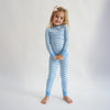 Soft bamboo baby pajamas in blue wave print, eco-friendly sleepwear.