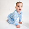 Soft bamboo baby pajamas in blue wave print, eco-friendly sleepwear.