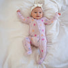 Soft bamboo baby pajamas in pink floral print, eco-friendly sleepwear.