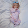 Soft bamboo baby pajamas in pink floral print, eco-friendly sleepwear.