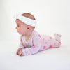 Soft bamboo baby pajamas in pink floral print, eco-friendly sleepwear.