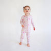 Soft bamboo baby pajamas in pink floral print, eco-friendly sleepwear.