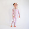 Soft bamboo baby pajamas in pink floral print, eco-friendly sleepwear.