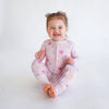 Soft bamboo baby pajamas in pink floral print, eco-friendly sleepwear.