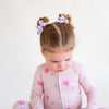 Soft bamboo baby pajamas in pink floral print, eco-friendly sleepwear.