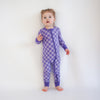 Soft bamboo baby pajamas in purple checkered print, eco-friendly sleepwear.